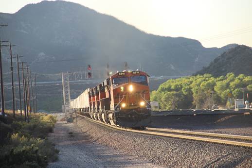 This eastbound stack train led by BN-SF 6518, a GE ES44C4; BN-SF 4427, a GE C44-9W; BN-SF 7416, a GE ES44DC; BN-SF 7560, a GE ES44DC; and BN-SF 4103 a GE C44-9W, is at Cajon on Track #3.